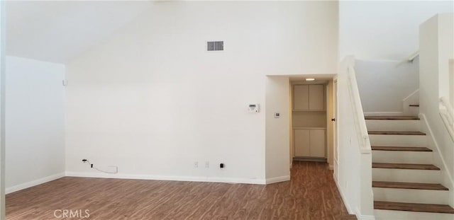 12180 Westerly Trl, Moreno Valley, CA 92557 - stairs featuring wood finished floors and high vaulted ceiling
