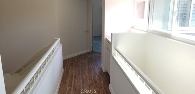 12180 Westerly Trl, Moreno Valley, CA 92557 - corridor with dark wood-type flooring, stairway, and healthy amount of natural light