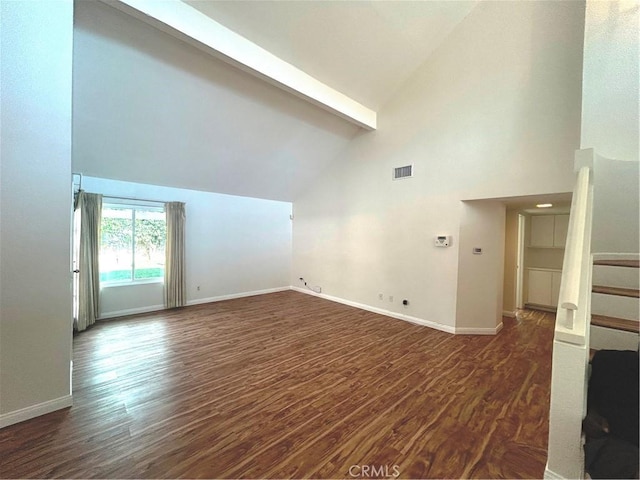 12180 Westerly Trl, Moreno Valley, CA 92557 - unfurnished room with wood finished floors, beamed ceiling, high vaulted ceiling, and stairs