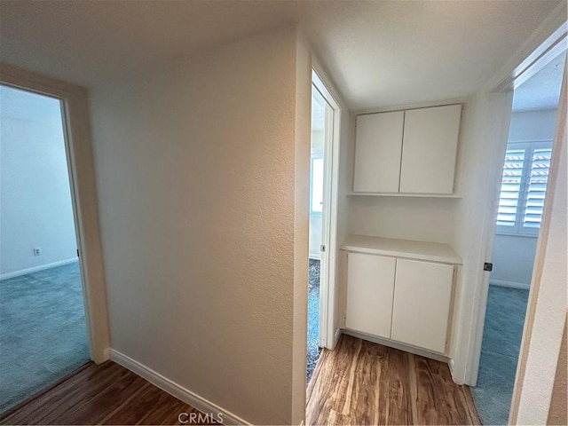 12180 Westerly Trl, Moreno Valley, CA 92557 - hall featuring wood finished floors and carpet