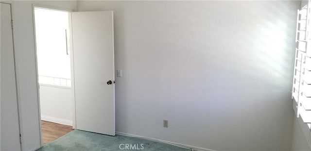 12180 Westerly Trl, Moreno Valley, CA 92557 - carpeted spare room with baseboards