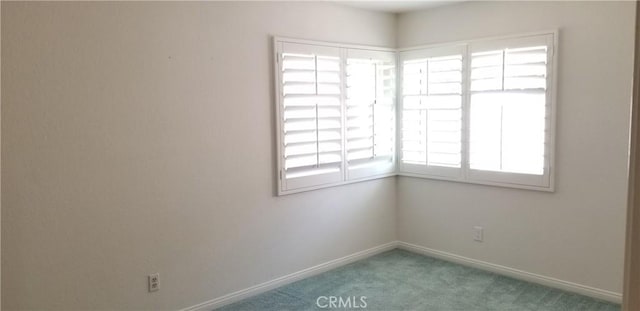 12180 Westerly Trl, Moreno Valley, CA 92557 - carpeted spare room featuring baseboards