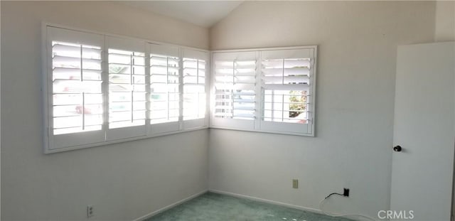 12180 Westerly Trl, Moreno Valley, CA 92557 - carpeted spare room with vaulted ceiling and baseboards