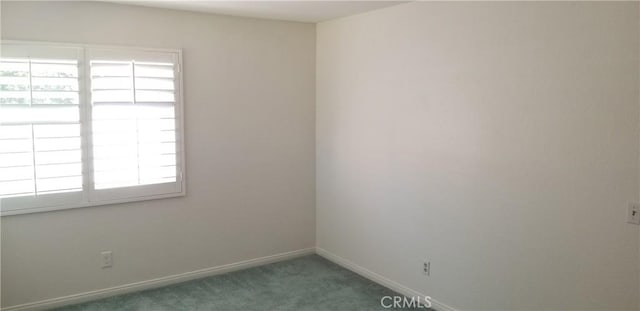 12180 Westerly Trl, Moreno Valley, CA 92557 - spare room featuring carpet flooring and baseboards