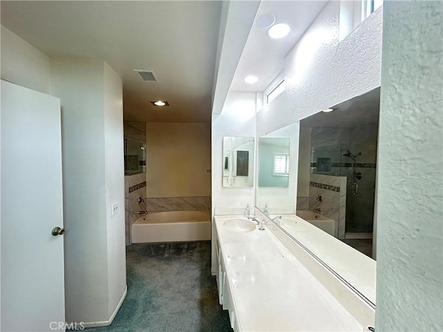 12180 Westerly Trl, Moreno Valley, CA 92557 - bathroom featuring a garden tub, recessed lighting, a stall shower, and double vanity