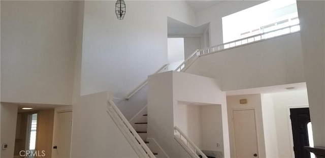 12180 Westerly Trl, Moreno Valley, CA 92557 - stairway featuring a high ceiling