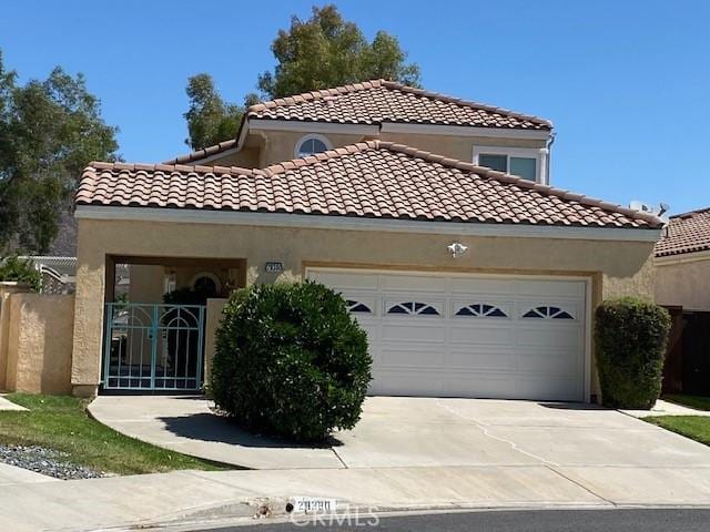28380 Champions Dr, Menifee, CA 92584 - mediterranean / spanish-style house with a garage, concrete driveway, stucco siding, and a tiled roof
