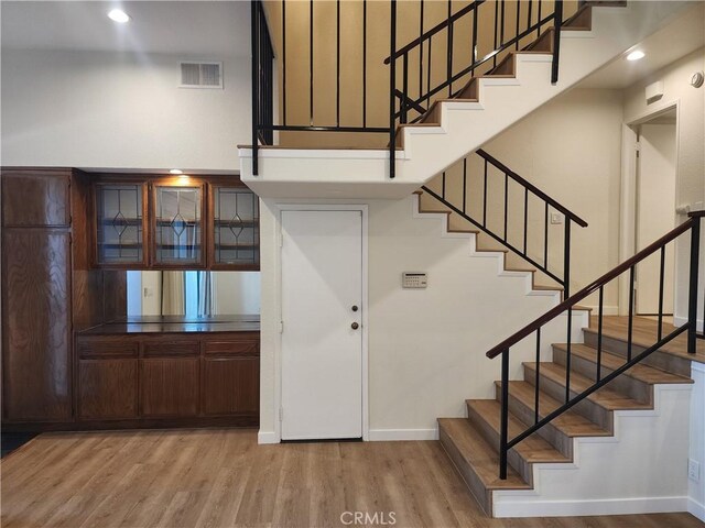 10201 Mason Ave Unit 34, Chatsworth, CA 91311 - stairs featuring wood finished floors and recessed lighting