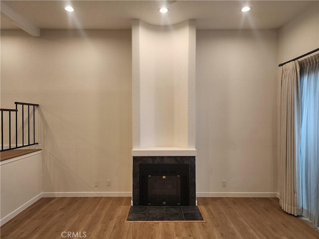 10201 Mason Ave Unit 34, Chatsworth, CA 91311 - unfurnished living room featuring wood finished floors, a tile fireplace, and recessed lighting
