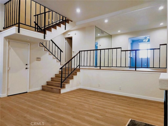 10201 Mason Ave Unit 34, Chatsworth, CA 91311 - stairs with wood finished floors, ceiling fan, and recessed lighting