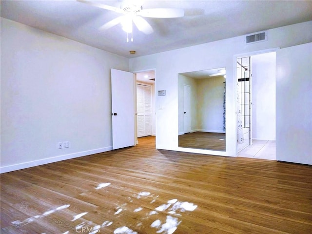 10201 Mason Ave Unit 34, Chatsworth, CA 91311 - unfurnished bedroom featuring wood finished floors and a ceiling fan