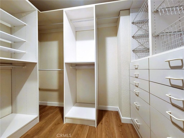 10201 Mason Ave Unit 34, Chatsworth, CA 91311 - walk in closet with light wood finished floors