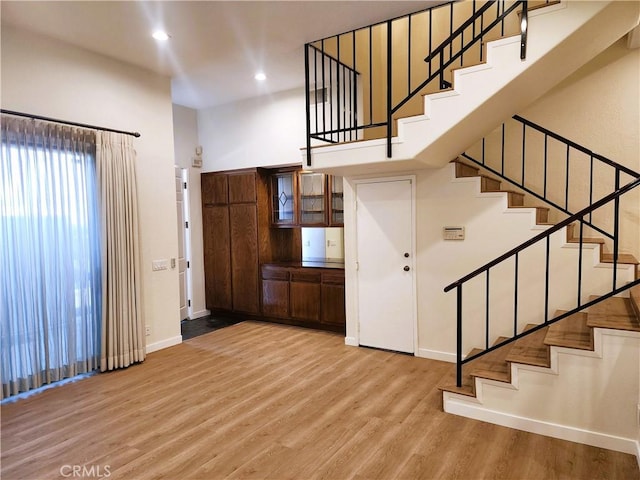 10201 Mason Ave Unit 34, Chatsworth, CA 91311 - entryway featuring stairs, wood finished floors, and recessed lighting