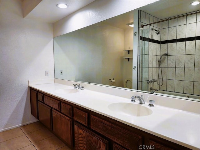 10201 Mason Ave Unit 34, Chatsworth, CA 91311 - full bath with a tile shower, double vanity, tile patterned floors, and a textured wall