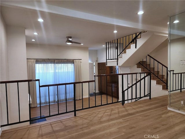 10201 Mason Ave Unit 34, Chatsworth, CA 91311 - stairway with wood finished floors and recessed lighting