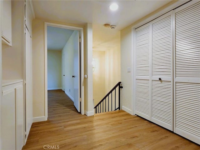 10201 Mason Ave Unit 34, Chatsworth, CA 91311 - corridor featuring an upstairs landing and light wood-style floors