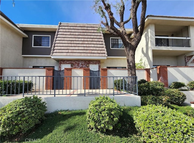 10201 Mason Ave Unit 34, Chatsworth, CA 91311 - multi unit property with brick siding, stucco siding, and mansard roof