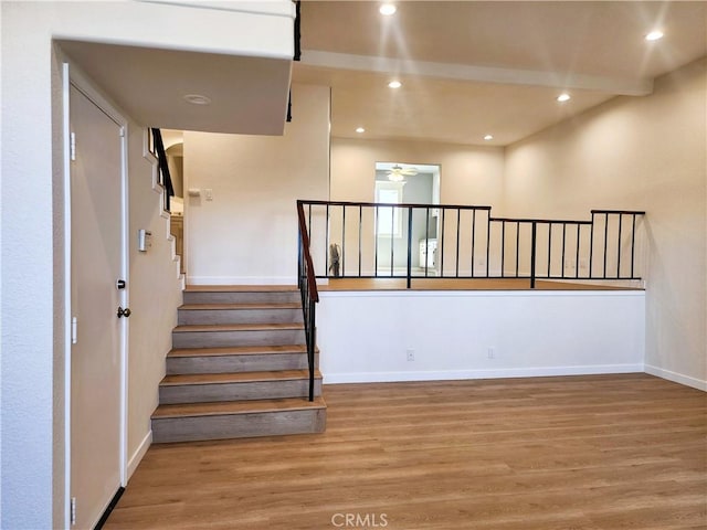 10201 Mason Ave Unit 34, Chatsworth, CA 91311 - stairway featuring wood finished floors, recessed lighting, and a ceiling fan