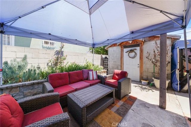 430 E 104th St, Los Angeles, CA 90003 - fenced backyard featuring an outdoor hangout area and a patio