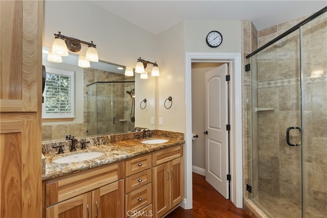 1179 Aleutian Dr, Lake Arrowhead, CA 92352 - full bathroom with a shower stall, double vanity, and wood finished floors