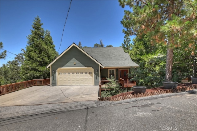 1179 Aleutian Dr, Lake Arrowhead, CA 92352 - view of front of property with a garage, concrete driveway, and a porch