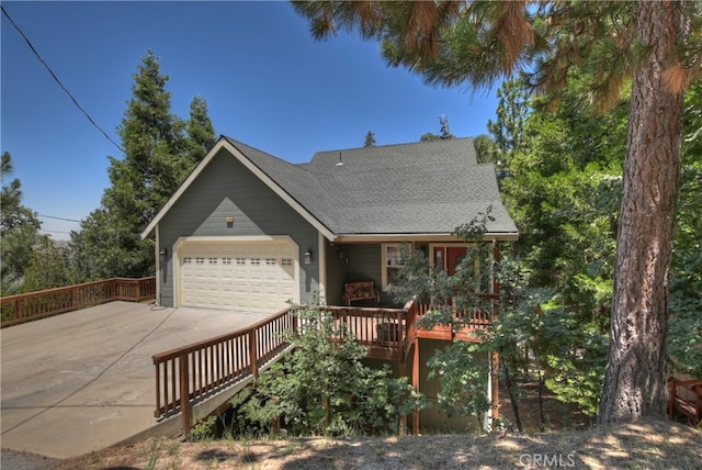 1179 Aleutian Dr, Lake Arrowhead, CA 92352 - view of front facade featuring an attached garage, concrete driveway, and roof with shingles