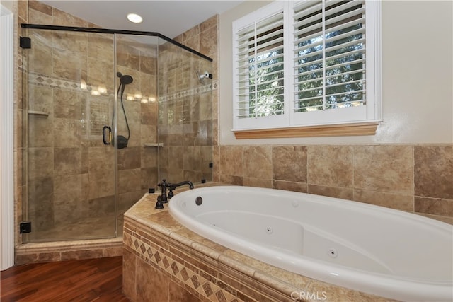 1179 Aleutian Dr, Lake Arrowhead, CA 92352 - bathroom featuring a tub with jets, a shower stall, and wood finished floors