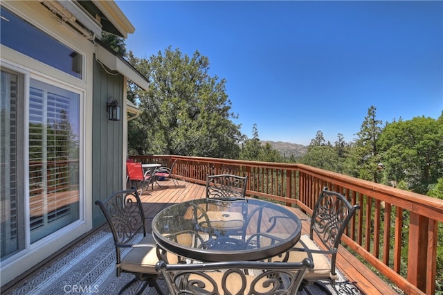 1179 Aleutian Dr, Lake Arrowhead, CA 92352 - wooden deck featuring outdoor dining area