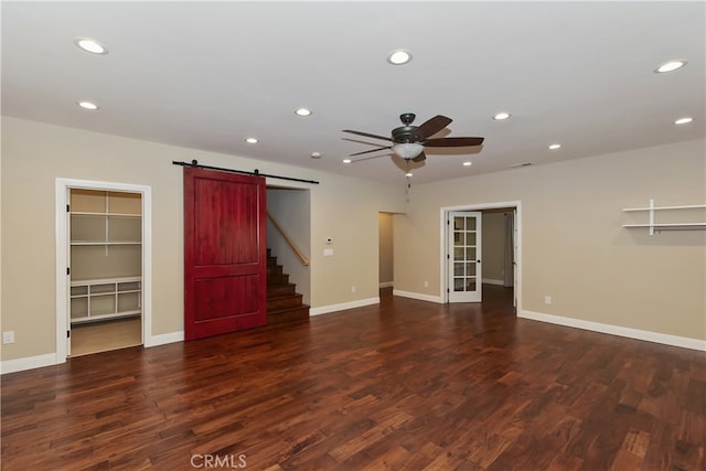 1179 Aleutian Dr, Lake Arrowhead, CA 92352 - unfurnished living room featuring a ceiling fan, a barn door, recessed lighting, wood finished floors, and stairway