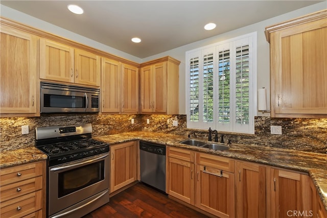 1179 Aleutian Dr, Lake Arrowhead, CA 92352 - kitchen with appliances with stainless steel finishes, dark wood finished floors, dark stone countertops, tasteful backsplash, and recessed lighting