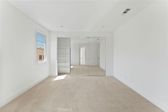 3201 4th Ave, Corona Del Mar, CA 92625 - unfurnished bedroom with light colored carpet and a closet