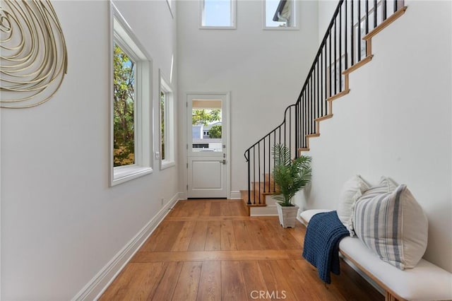 3201 4th Ave, Corona Del Mar, CA 92625 - foyer entrance featuring light wood finished floors, stairway, and a towering ceiling