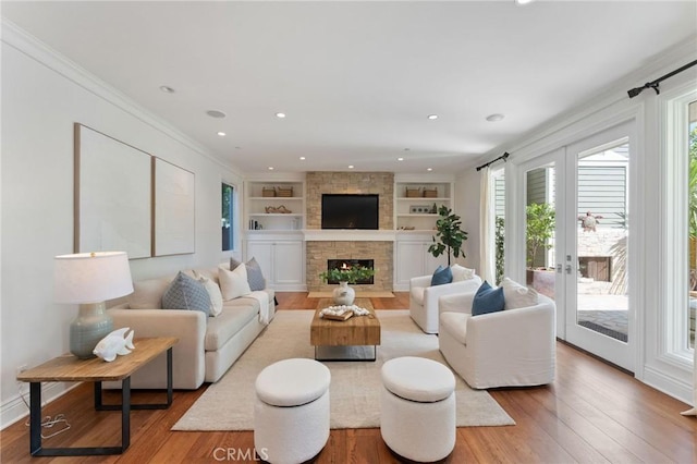 3201 4th Ave, Corona Del Mar, CA 92625 - living room featuring wood-type flooring, built in features, a fireplace, recessed lighting, and crown molding