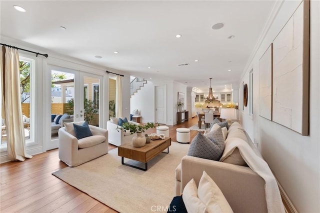 3201 4th Ave, Corona Del Mar, CA 92625 - living area with recessed lighting, light wood-style flooring, a chandelier, french doors, and stairs