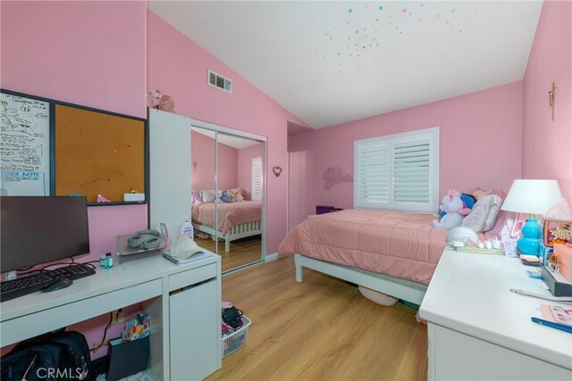 23220 Colony Park Dr, Carson, CA 90745 - bedroom featuring vaulted ceiling, light wood finished floors, a desk, and a closet
