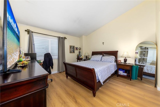 23220 Colony Park Dr, Carson, CA 90745 - bedroom featuring light wood-type flooring, vaulted ceiling, and an office area