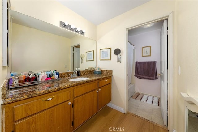 23220 Colony Park Dr, Carson, CA 90745 - bathroom with vanity, shower / bath combo, and wood finished floors