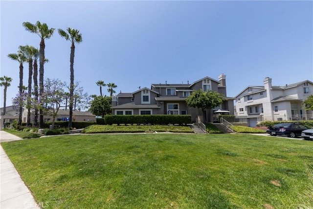 23220 Colony Park Dr, Carson, CA 90745 - surrounding community featuring a residential view and a lawn