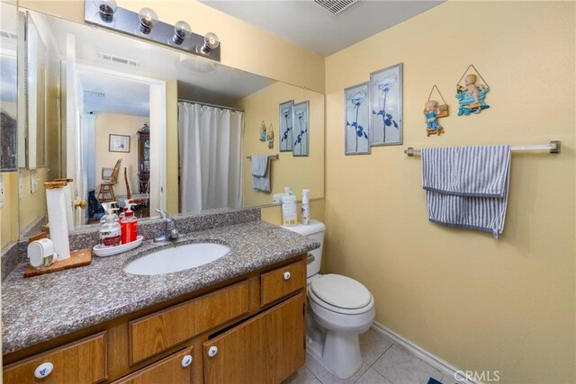23220 Colony Park Dr, Carson, CA 90745 - full bathroom with vanity, tile patterned flooring, and a shower with shower curtain