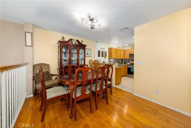 23220 Colony Park Dr, Carson, CA 90745 - dining space featuring light wood finished floors and recessed lighting