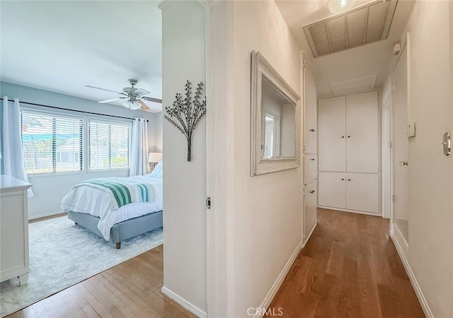 10424 Gloria Ave, Granada Hills, CA 91344 - hallway with wood finished floors and attic access