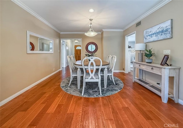 10424 Gloria Ave, Granada Hills, CA 91344 - dining area with ornamental molding and light wood-style floors