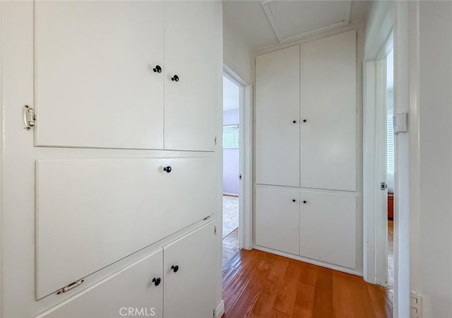 10424 Gloria Ave, Granada Hills, CA 91344 - corridor with wood finished floors and attic access