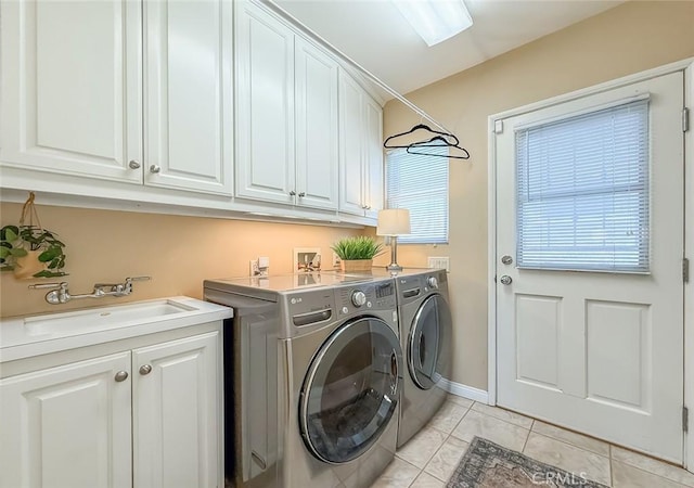 10424 Gloria Ave, Granada Hills, CA 91344 - laundry room featuring washer and dryer, cabinet space, and light tile patterned floors