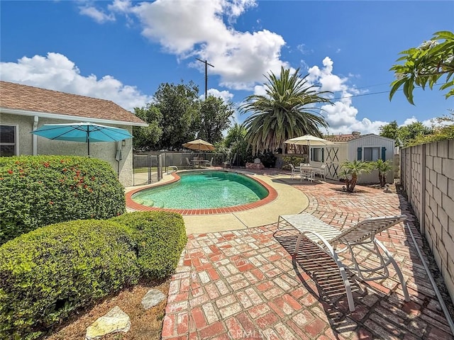 10424 Gloria Ave, Granada Hills, CA 91344 - view of pool with a fenced backyard, a patio area, and an outbuilding