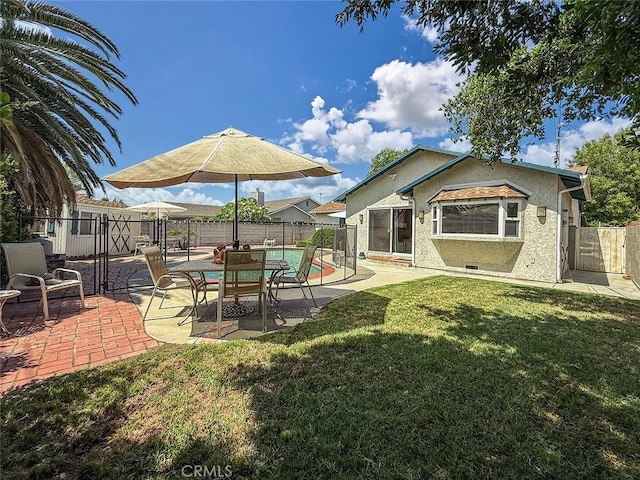 10424 Gloria Ave, Granada Hills, CA 91344 - fenced backyard featuring a gate and a patio