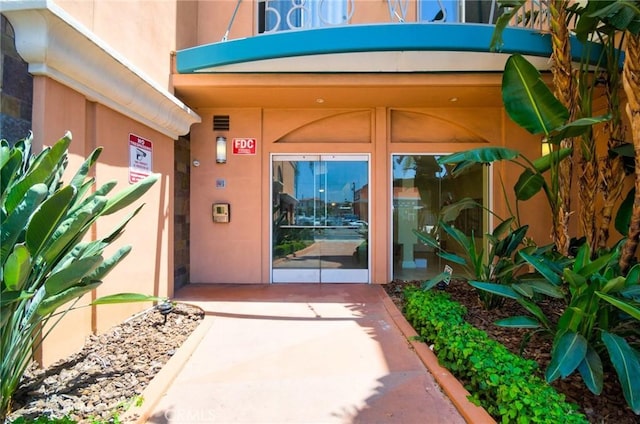 580 W Main St Unit 105, Alhambra, CA 91801 - view of exterior entry featuring stucco siding