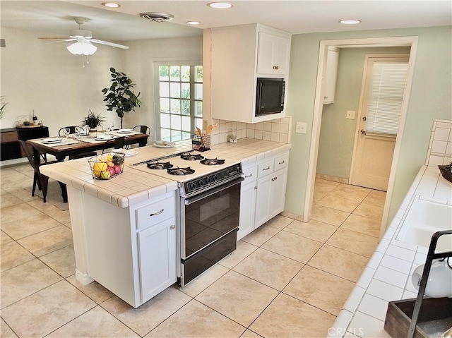 2524 Littleton Pl, Costa Mesa, CA 92626 - kitchen featuring range with gas cooktop, tile countertops, white cabinets, recessed lighting, and a ceiling fan