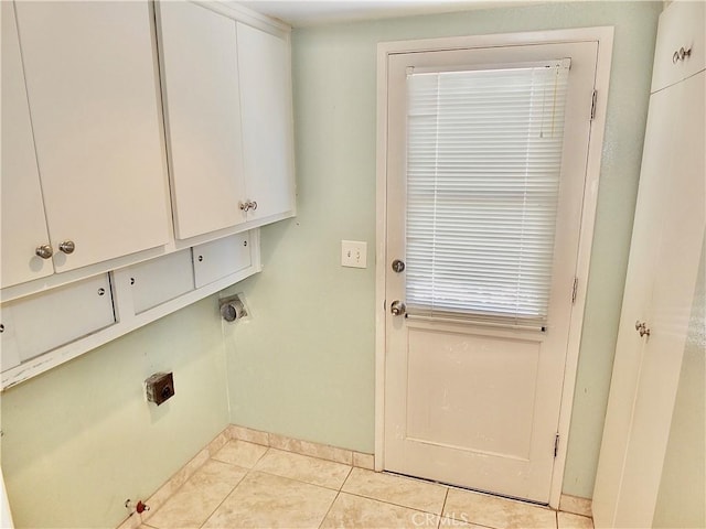 2524 Littleton Pl, Costa Mesa, CA 92626 - laundry area with cabinet space, electric dryer hookup, and light tile patterned floors