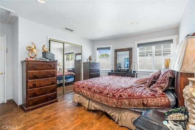 7549 Variel Ave, Canoga Park, CA 91303 - bedroom with wood finished floors, a closet, recessed lighting, and attic access